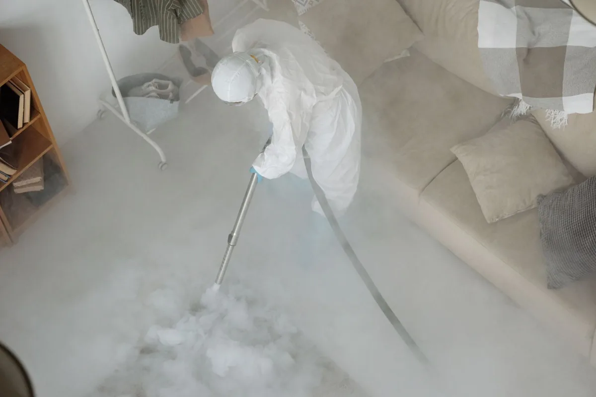 Biohazard cleanup technician in protective equipment, Red Bank, TN